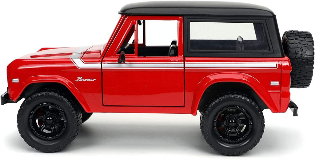 1973 Ford Bronco Red with Black Top and Silver Stripe with Extra Wheels Just Trucks Series 1/24 Diecast Model Car by Jada 32425